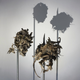 Illustration for article titled Gruesome shadow art transforms garbage and mummified rats into severed heads